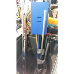 BUNDLE OF BROOMS, HOCKEY STICK, AND WEATHER STRIPPING