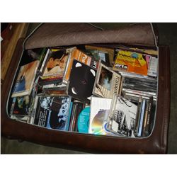 BROWN LEATHER BAG FULL OF VARIOUS MUSIC CDS