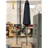 Qty 1 umbrellas with 2 solid steel stand, material sun faded, stand faded spots of rust