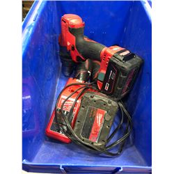Milwaukee M18 drill, M12 drivers M12 light & charging station