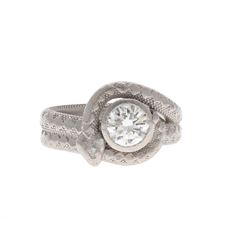 RING: Platinum snake ring, size 11; (1) round brilliant cut diamond, 8.0mm diameter = an estimated 1