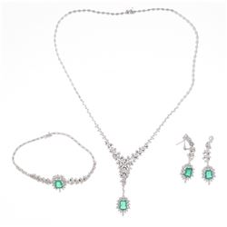 JEWELRY SET: [1] 18k white gold matching set necklace, earrings and bracelet; (4) emerald cut emeral