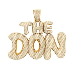 PENDANT: [1] 10k yellow gold "The Don" pendant; (1205) round brilliant cut diamonds, 1.1mm-1.6mm = a