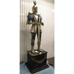 SCULPTURE: Bronze Knight in armor, holding sword, standing on painted base. 80" H on base 22" x 29" 