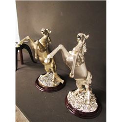 SCULPTURE: Pair of silver rearing horses on wood bases. No markings found noted on previous report. 