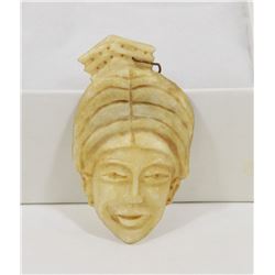 HAND CARVED PENDANT FROM OYSTER SHELL
