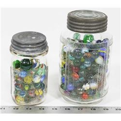 OLD JARS FILLED WITH VINTAGE MARBLES.