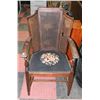 Image 1 : VINTAGE WOOD AND WICKER NEEDLEPOINT CHAIR AS IS