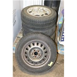 SET OF FOUR 185/65R14 TIRES ON RIMS WITH HUBCAPS