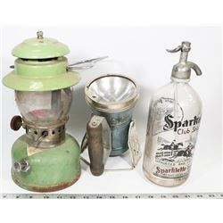 FLAT WITH ANTIQUE COLEMAN LANTERN, SELTZER WATER