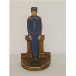 9" PAINTED CAST IRON DOORSTOP - BELL HOP IN A BLUE UNIFORM
