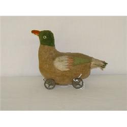 EARLY STEIFF PLUSH DUCK PULL TOY ON TIN WHEELS