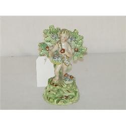 5 1/4" EARLY WALTON FIGURE OF BOY W/ FLOWER BASKET