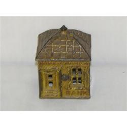 3 1/2" PAINTED CAST IRON BUILDING STILL BANK - YELLOW PAINTED HOME SAVINGS BANK