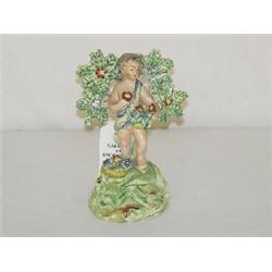 5 1/4" EARLY WALTON FIGURE OF BOY W/ FLOWER BASKET