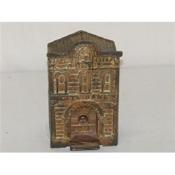 5 1/2" CAST IRON CITY BANK W/ TELLER STILL BANK, BRASS FINISH