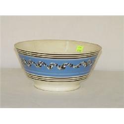 9" MOCHAWARE BOWL W/ EARTHWORM DECORATION ON BLUE BACKGROUND