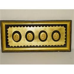 (4) GOLD PLASTER CAMEO MEDALLIONS IN A GOLD & BLACK FRAME