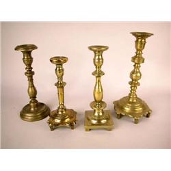 A GROUP OF FOUR BRASS CANDLESTICKS, EASTERN EUROPEAN