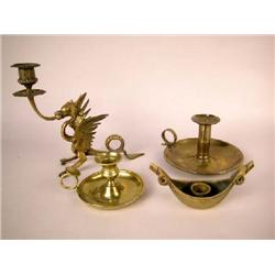 A GROUP OF FOUR BRASS AND BRONZE CHAMBERSTICKS