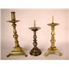 Image 1 : A GROUP OF THREE BRASS SINGLE CANDLESTICKS