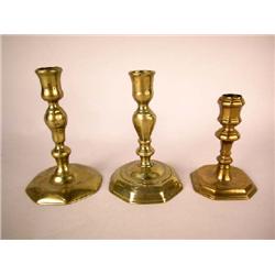 A GROUP OF THREE BRASS CANDLESTICKS, ENGLISH