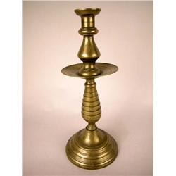 A BRASS CANDLESTICK, SPANISH CAST IN FOUR PIECES