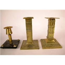 A GROUP OF THREE BRASS CANDLESTICKS