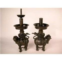 A PAIR OF CAST BRONZE FIGURAL PRICKET CANDLESTICKS. CHINESE