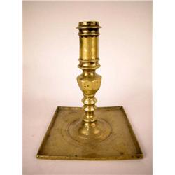 A BRASS SQUARE BASE CANDLESTICK, SPANISH