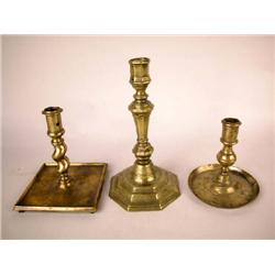 A GROUP OF THREE BRASS CANDLESTICKS. CONTINENTAL