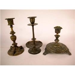 A GROUP OF THREE PATINATED BRASS CANDLESTICKS, CONTINENTAL