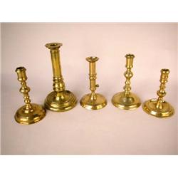 A GROUP OF FIVE ROUND BASE BRASS CANDLESTICKS, ENGLISH