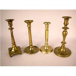 A GROUP OF FOUR BRASS CANDLESTICKS, EASTERN EUROPEAN
