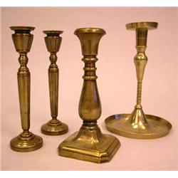 A GROUP OF FOUR BRASS CANDLESTICKS, CONTINENTAL