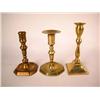 Image 1 : A GROUP OF THREE BRASS AND BELL METAL CANDLESTICKS, ENGLISH