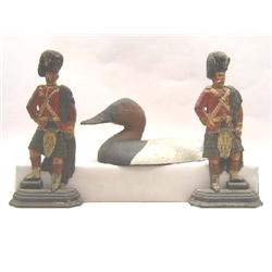 A PAINTED CAST-IRON FIGURE OF A CANVAS BACK AND TWO PAINTED CAST IRON FIGURAL BOOKENDS