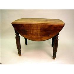 A LATE VICTORIAN WALNUT DROP LEAF DINING TABLE