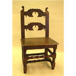A JACOBEAN CARVED OAK LANCASHIRE-TYPE CHAIR