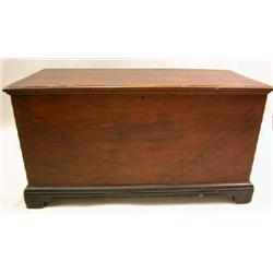 A BLACK AND RED PAINTED BLANKET CHEST