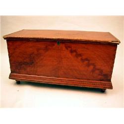 A LATE FEDERAL GRAIN-PAINTED AND COMB-DECORATED PINE BLANKET CHEST