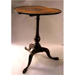 A CHIPPENDALE WALNUT TILT-TOP CANDLESTAND
