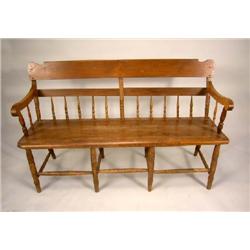 A DUCKLOW BRS. PLANK SEAT SETTEE.