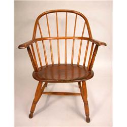 A SACK BACK WINDSOR ARM CHAIR