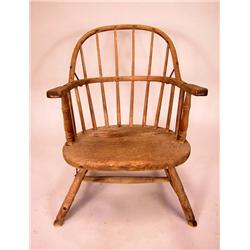 A SACK BACK WINDSOR ARM CHAIR