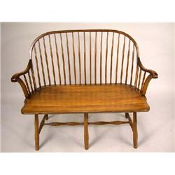 A DUCKLOE BOW BACK WINDSOR STYLE SETTEE