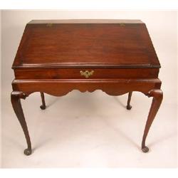 A QUEEN ANNE WALNUT DESK ON FRAME