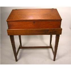 A FEDERAL WALNUT SLANT FRONT TABLE TOP TRAVELING DESK-ON-FRAME