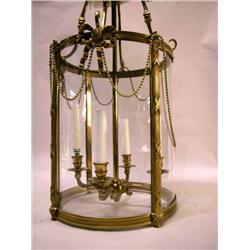 A PAIR OF GEORGIAN STYLE BRASS FOUR-LIGHT HALL LANTERNS