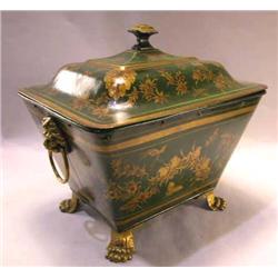 A VICTORIAN GREEN AND PARCEL-GILT TOLE SCUTTLE ON PAW FEET